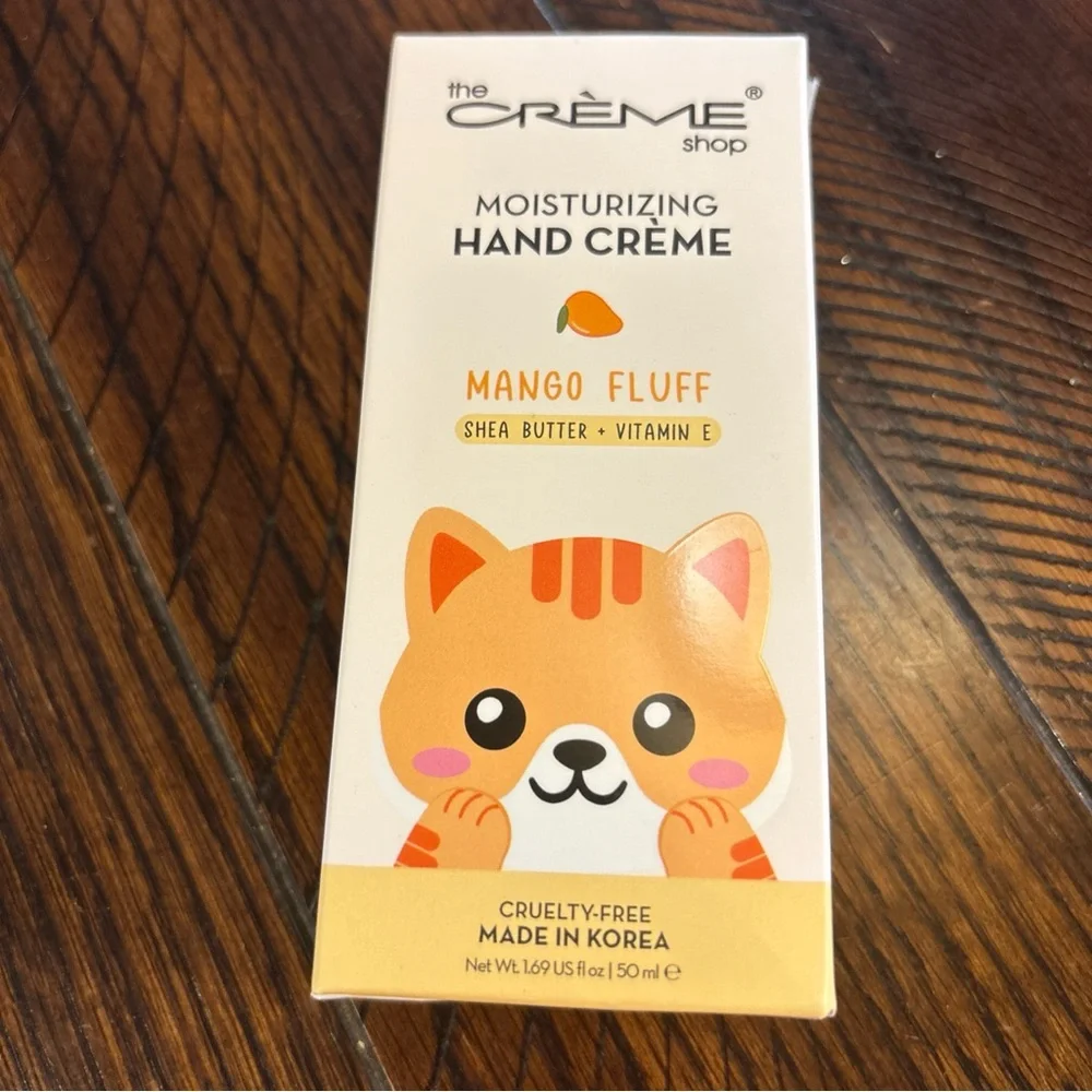 THE CREME SHOP HELLO KITTY MANGO FLUFF MOISTURIZING HAND CREAM 1.69 OZ